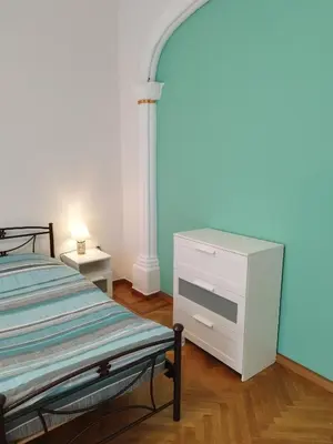 a bedroom with a bed and a white dresser at Rental room pilika4 in Athens