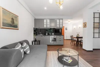 a living room with a couch and a table at Unique apartment next to Acropolis and metro in Athens