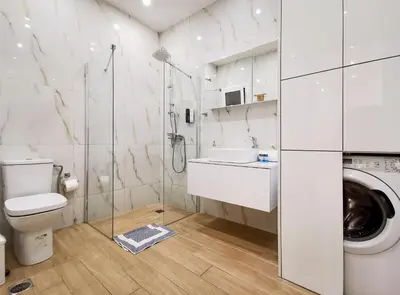 a bathroom with a shower toilet and a sink at Stunning apartment next to Acropolis and metro in Athens