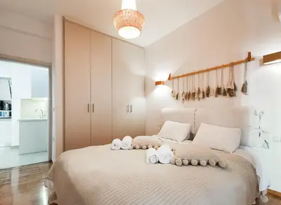 a bedroom with a bed with towels on it at Stunning apartment next to Acropolis and metro in Athens