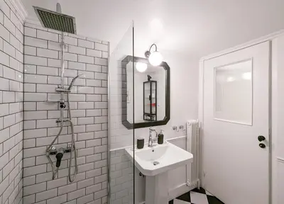 a white bathroom with a sink and a mirror at Chessboard styled 2BD apt next to Acropolis&Metro in Athens