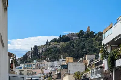 a view of a city with a mountain at Chessboard styled 2BD apt next to Acropolis&Metro in Athens