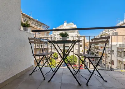 a balcony with a table and two chairs at Chessboard styled 2BD apt next to Acropolis&Metro in Athens