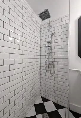 a white tiled shower with black and white tiles at Chessboard styled 2BD apt next to Acropolis&Metro in Athens