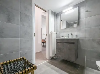 a bathroom with a sink and a mirror at Spacious apt for 5 guests next to Acropolis&metro in Athens