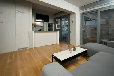 a living room with a couch and a table at Modern apartment with Great view in Athens