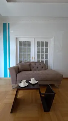 a living room with a couch and a coffee table at Athens Riviera Bee Home Appartments in Athens