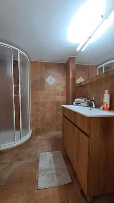 a bathroom with a shower and a sink and a tub at Athens Riviera Bee Home Appartments in Athens