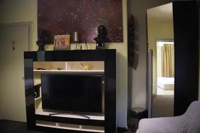 a flat screen tv in a living room at \u7ef4\u591a\u5229\u4e9a\u516c\u5bd3 in Athens