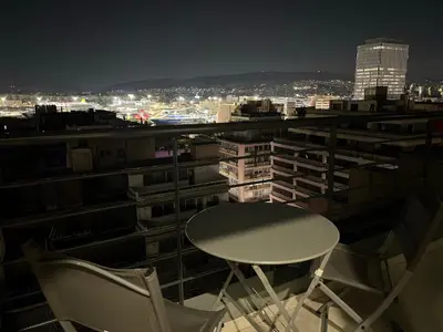a table and two chairs sitting on top of a building at Kolokotroni Apartment in Piraeus