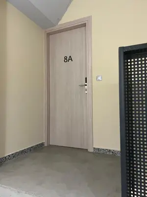 an empty room with a door with the number on it at Kolokotroni Apartment in Piraeus