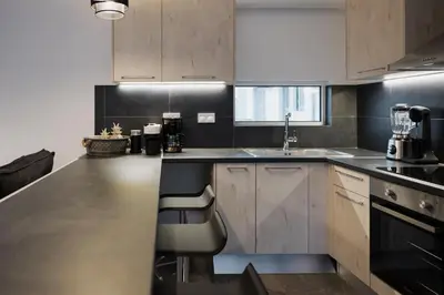 a kitchen with a sink and a counter top at Cosy Home Thissio in Athens