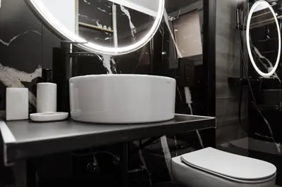 a bathroom with a toilet and two mirrors at Cosy Home Thissio in Athens