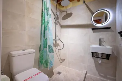 a bathroom with a toilet and a sink at Monastiraki metro st 1 bedroom apt for 2 by MPS in Athens