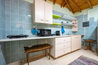 a kitchen with a counter top with a microwave at Monastiraki metro st 1 bedroom apt for 2 by MPS in Athens