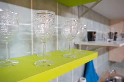 a group of wine glasses sitting on a shelf at Monastiraki metro st 1 bedroom apt for 2 by MPS in Athens