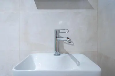a white sink with a faucet in a bathroom at Monastiraki metro st 1 bedroom apt for 2 by MPS in Athens