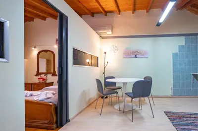a room with a bed and a table and chairs at Monastiraki metro st 1 bedroom apt for 2 by MPS in Athens