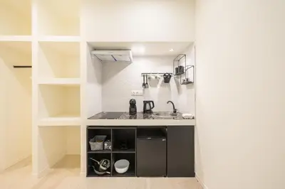 a small kitchen with a sink and shelves at Syrou 1834 in Athens