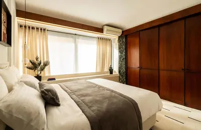 a bedroom with a large bed and a window at ATELIER 33 , Acropolis Apartments in Athens