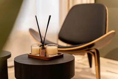 a desk with two candles and a chair at ATELIER 33 , Acropolis Apartments in Athens