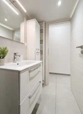 a white bathroom with a sink and a shower at Modern&Stylish 1BD apt next metro and Acropolis in Athens