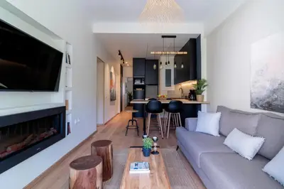 a living room with a couch and a table at Elegant&Cozy 2BD Historic Center next to metro in Athens