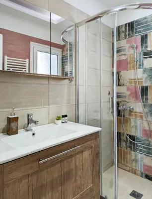 a bathroom with a sink and a shower at Modern&Quiet 2BD apt on a pedestrian in Athens