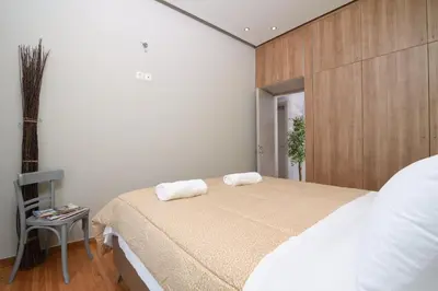 a bedroom with a bed with two towels on it at Iconic 2BD apt next to Historic center and metro in Athens