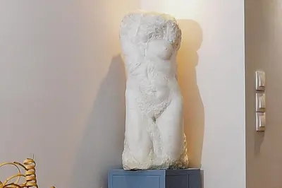 a statue of a cat sitting on top of a table at Iconic 2BD apt next to Historic center and metro in Athens