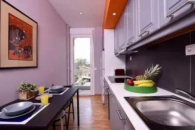 a kitchen with a sink and a counter with fruits on it at Iconic 2BD apt next to Historic center and metro in Athens