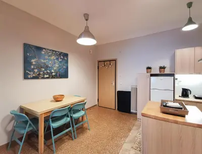 a kitchen and dining room with a table and chairs at Hidden Gem next to Acropolis&metro in Athens