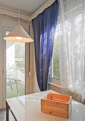 a table with a wooden box on it in front of a window at Charming 2BD apt next to metro station in Athens