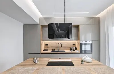 a kitchen with a sink and a tv above it at Acropolis view 2BD penthouse next to tram and port in Piraeus