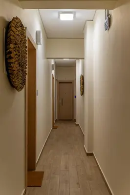 an empty hallway with a hallwayngthngthngthngthngthngthngthngthngthngth at Phalerus Suites in Athens