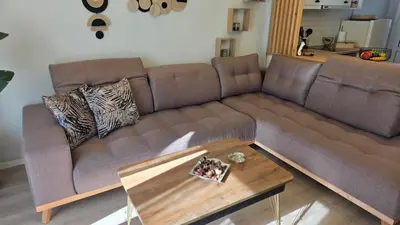 a living room with a couch and a coffee table at Glory Appartment pippinou in Athens