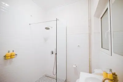 a bathroom with a shower and a sink at Urban Exarchia for Groups , Nightlife Area in Athens