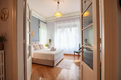 a small bedroom with a bed and a window at Urban Exarchia for Groups , Nightlife Area in Athens