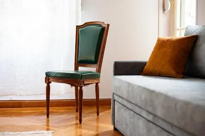 a chair sitting next to a couch in a living room at Urban Exarchia for Groups , Nightlife Area in Athens