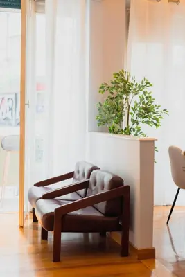 a bench in a room with a potted plant at Urban Exarchia for Groups , Nightlife Area in Athens