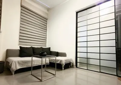a living room with a bed and a table at Luxsuite Premium with Panorama Rooftop in Athens