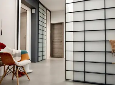 a room with glass doors and a chair at Luxsuite Premium with Panorama Rooftop in Athens