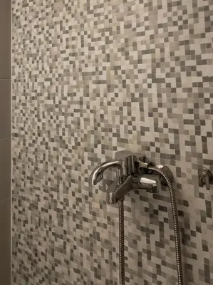 a shower with a shower head in a bathroom at Luxsuite Premium with Panorama Rooftop in Athens