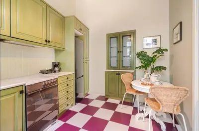 a kitchen with a table and chairs in it at Acropolis 360 Residence,2 bedr in Athens