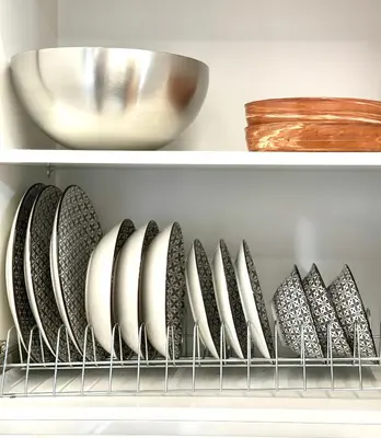 a row of plates and bowls on a shelf at Modern Bohemian Suites ATHENS -- AVM in Athens