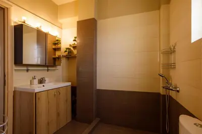 a bathroom with a sink and a shower at Villa Vegera in Anavissos