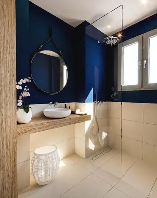 a bathroom with blue walls and a sink and a mirror at Historic Elegance in Acropolis in Athens