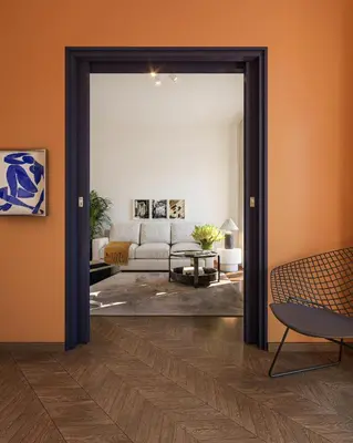 an open door into a living room with a couch at Historic Elegance in Acropolis in Athens