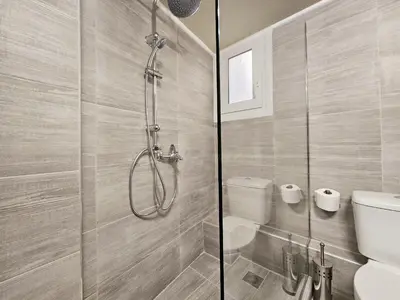 a bathroom with a shower and a toilet at EL Prestige Apartment - Athens Town in Athens