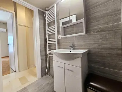 a bathroom with a sink and a mirror at EL Prestige Apartment - Athens Town in Athens